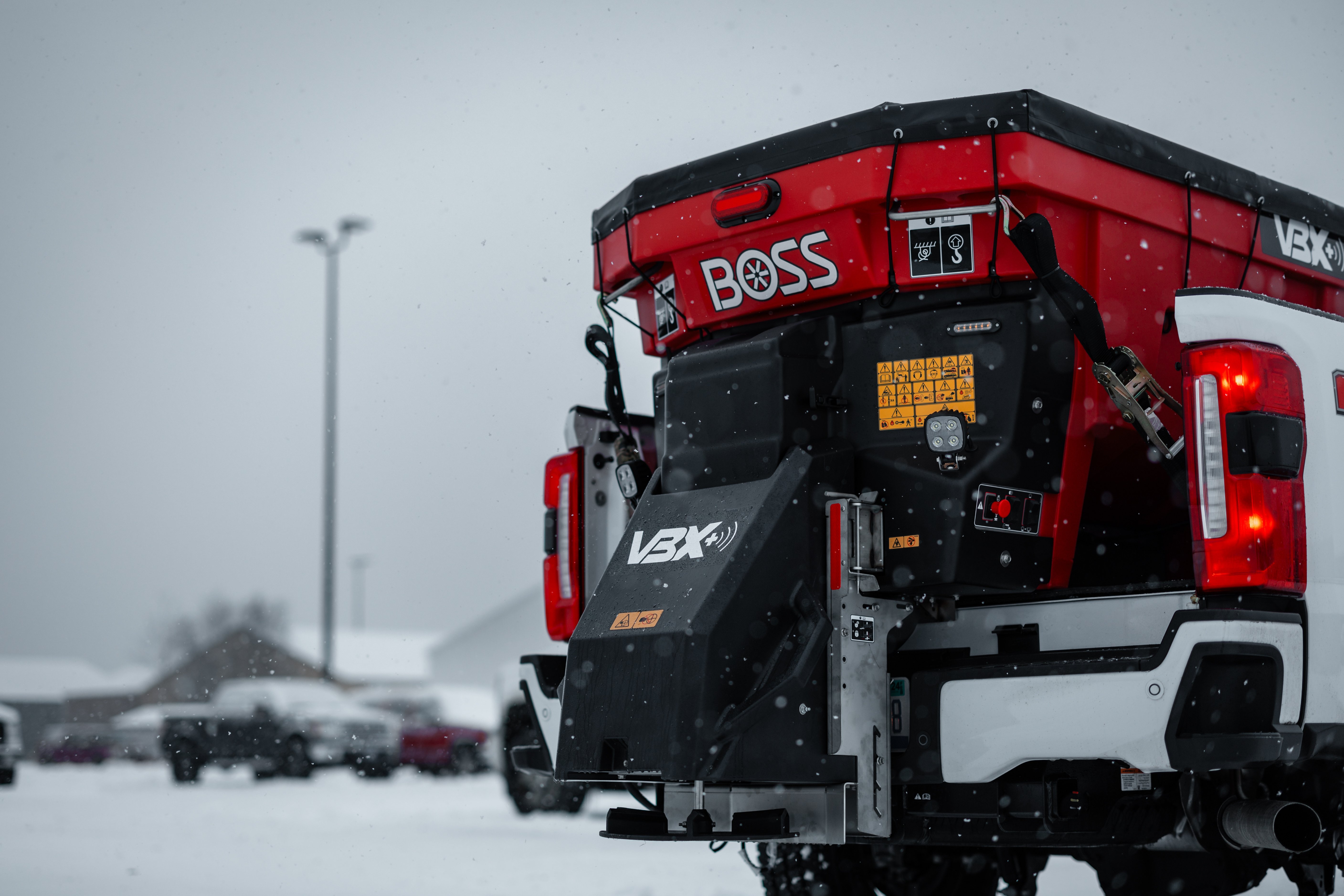 BOSS VBX+ hopper spreader mounted on a pickup truck
